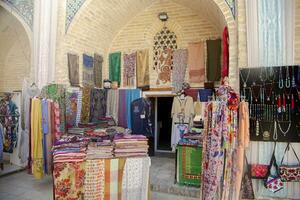 Bukhara, Uzbekistan - March 13, 2019 Outdoor street shops inside of Nadir Divan-Begi Madrasah photo