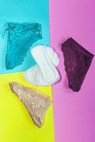 Sanitary pads and female panties. Medicine, women health and ovulation concept. Copy space photo