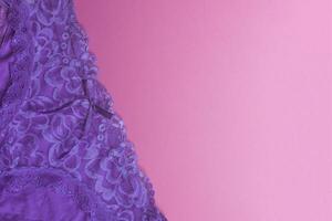 Women panties on pink. Violet women underwear on the pink background. Free space photo
