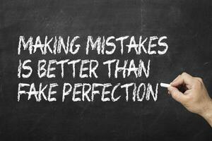 Making mistakes is better than fake perfection on the blackboard photo