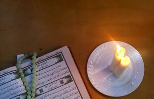 The Holy Quran and lights. Muslims holy book Koran. Open pages of the Holy Quran. Free space photo