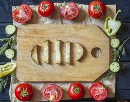 Salad ingredients. Fresh raw vegetables on wood. Healthy cooking salad photo