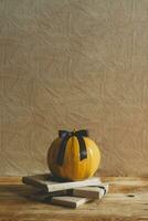 Celebrating Halloween. Orange and black pumpkins with decorated gift boxes photo