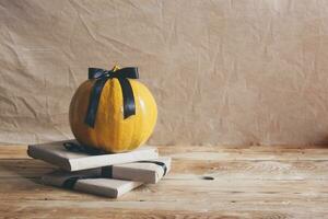 Celebrating Halloween. Orange and black pumpkins with decorated gift boxes photo