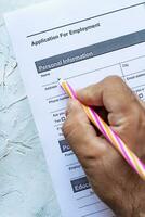 Filling employment application form photo