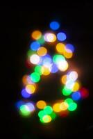 número 8 hecho con el bokeh de Navidad luces foto