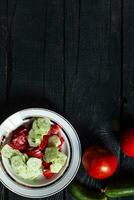 Fresh healthy cucumber and tomato salad photo