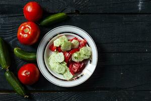 Fresh healthy cucumber and tomato salad photo