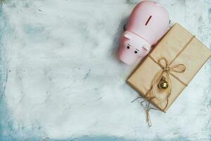 Planning your Christmas budget concept. Christmas toys and piggy bank from above photo