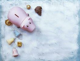 Planning your Christmas budget concept. Christmas toys and piggy bank from above photo