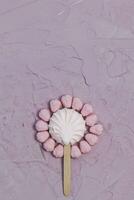 Plate of Marshmallows on pink background. Colorful marshmallow sweets with copy space photo