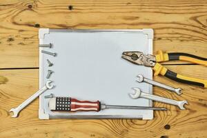 Labor day background with working tools and whiteboard photo