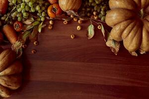 Autumn background with pumpkins and fruits photo