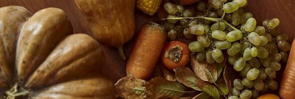 Autumn background with pumpkins and fruits photo