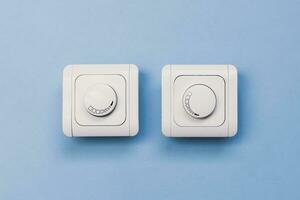 Dimmer Light Switch. A wall switch. Electrician switch. White rolling electricity switch photo