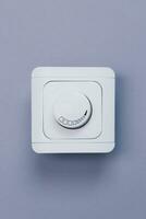Dimmer Light Switch. A wall switch. Electrician switch. White rolling electricity switch photo