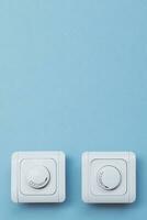 Dimmer Light Switch. A wall switch. Electrician switch. White rolling electricity switch photo