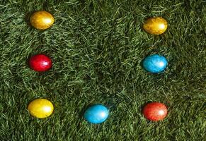 Colorful Easter eggs on the grass photo