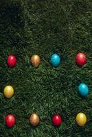 Colorful Easter eggs on the grass photo