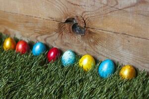 Colorful Easter eggs on the grass photo