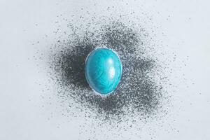 Blue easter egg with color spread photo
