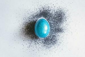 Blue easter egg with color spread photo