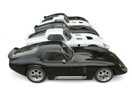 Black and white vintage sports cars - side view photo