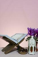 Ramadan background. Rehal with open Quran. Quran open in wooden placemat photo