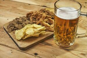 Beer glass and snacks photo