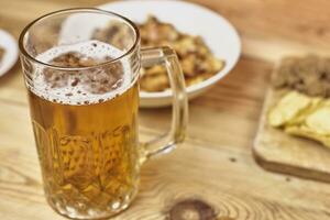 Beer glass and snacks photo