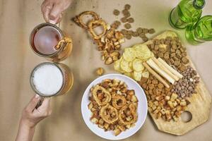 Drinking beer. Table full of beer snacks photo