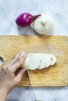Cutting organic onions. Preparing salad photo