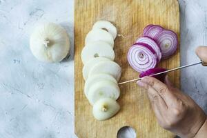 Cutting organic onions. Preparing salad photo