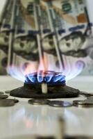 Burning gas stove burner and money photo