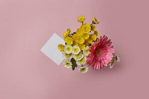 Flowers and blank paper photo