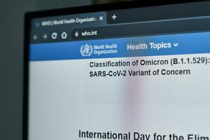 Tashkent, Uzbekistan - 27 November, 2021 WHO published first announcement about COVID-19 new variant called Omicron photo