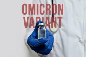 A doctor holds vaccine against new covid-19 omicron variant photo