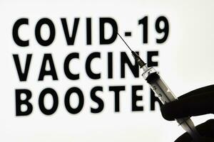covid-19 vacuna aumentador de presión dosis foto