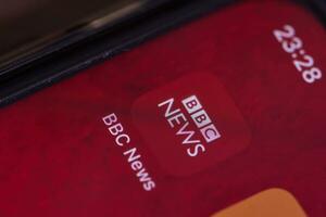 BBC news mobile application on smartphone screen photo