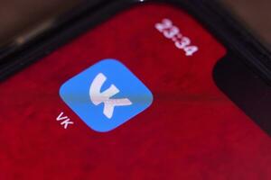 Vk or vkontakte mobile application on smartphone screen photo