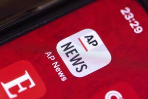 Associated Press mobile application on smartphone screen photo