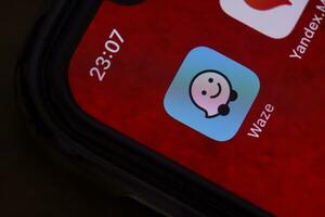 Waze mobile application on smartphone screen photo