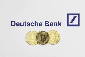 Bitcoin and ethereum cryptocurrency coins on Deutsche Bank logotype photo