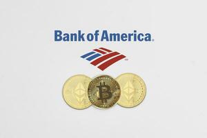 Bitcoin and ethereum cryptocurrency coins on Bank of America logotype photo