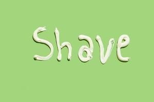 Shave word written with shaving cream photo