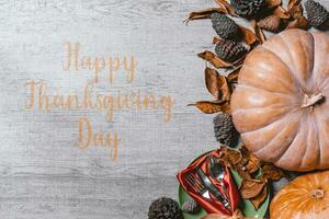Happy thanksgiving day - Autumnal background with harvest fall vegetables and autumnal leaves photo
