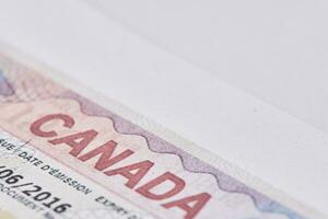 Canadian visa in passport. Close-up view photo