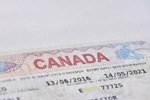 Canadian visa in passport. Close-up view photo