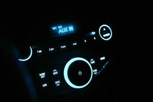 Car stereo in neon light at night photo