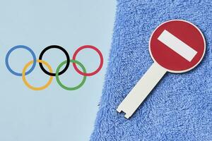 Boycotting Olympic Games - Restricting traffic sings and Olympic flag on towel photo